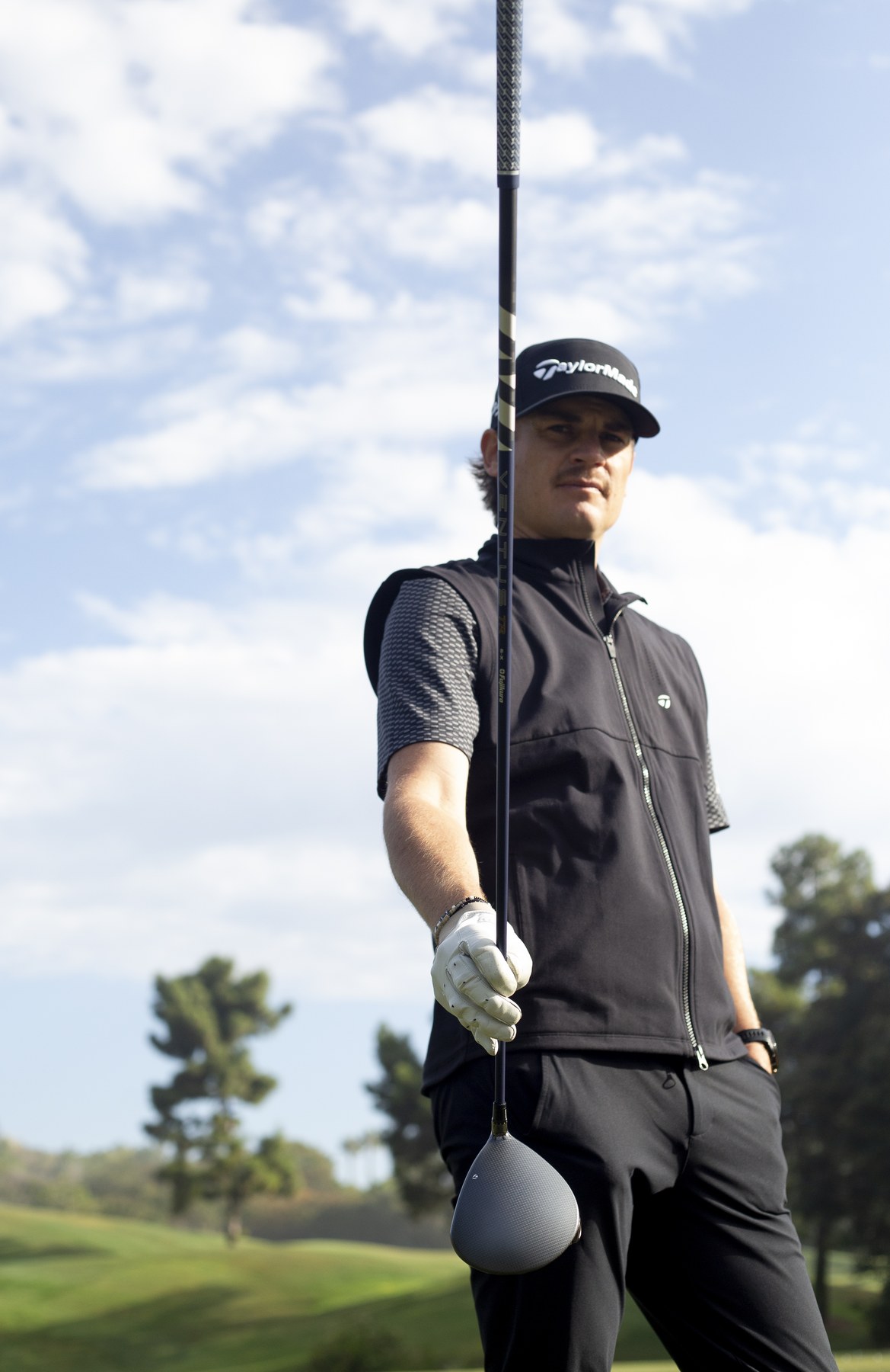 Golfer holding a Fujikura Ventus driver on the course
